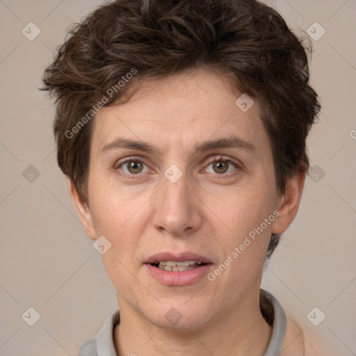 Joyful white adult female with short  brown hair and brown eyes