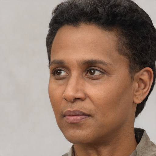 Neutral latino adult male with short  black hair and brown eyes