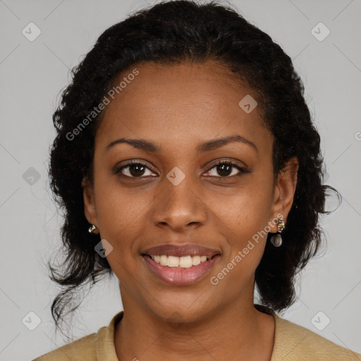 Joyful black young-adult female with medium  brown hair and brown eyes