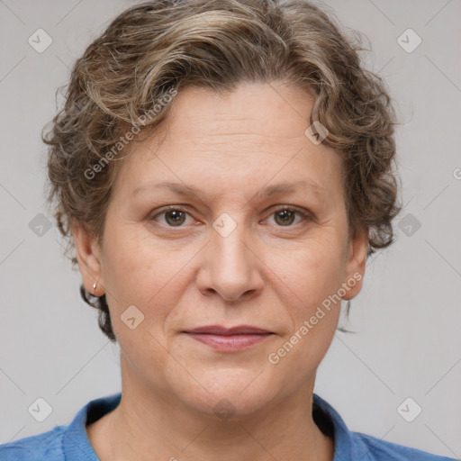 Joyful white adult female with short  brown hair and grey eyes