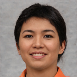 Joyful asian young-adult female with short  brown hair and brown eyes