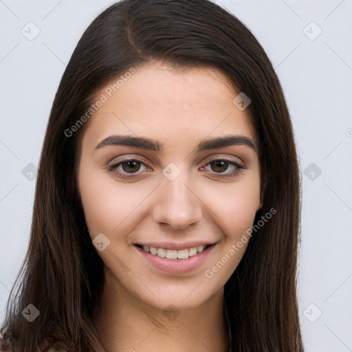 Joyful white young-adult female with long  brown hair and brown eyes