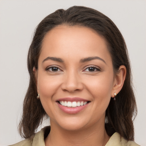 Joyful white young-adult female with medium  brown hair and brown eyes