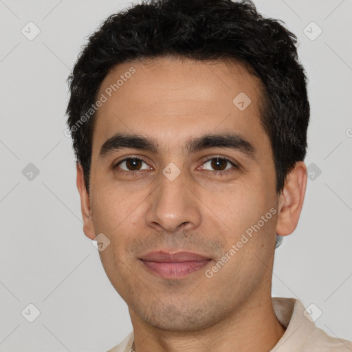 Joyful latino young-adult male with short  black hair and brown eyes