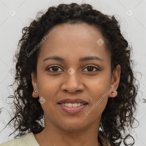 Joyful black young-adult female with long  brown hair and brown eyes