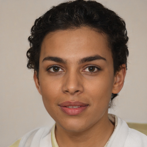 Joyful latino young-adult female with short  brown hair and brown eyes