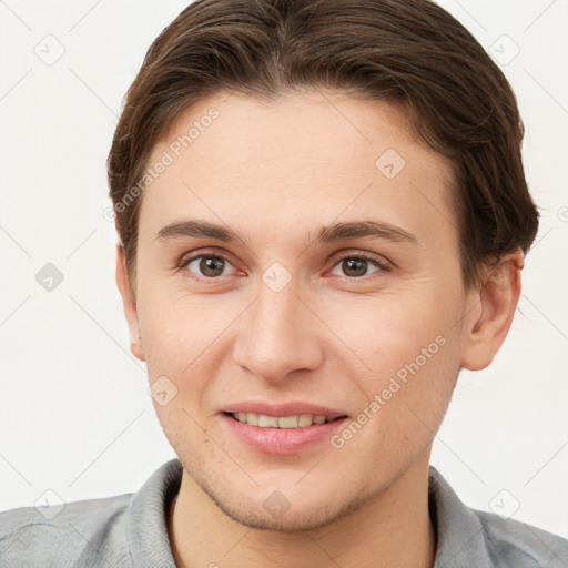 Joyful white young-adult female with short  brown hair and grey eyes