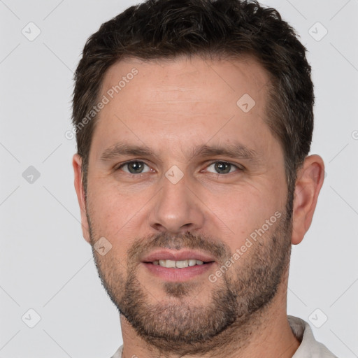 Joyful white adult male with short  brown hair and brown eyes