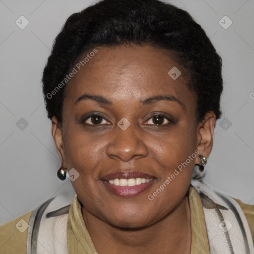 Joyful black adult female with short  brown hair and brown eyes