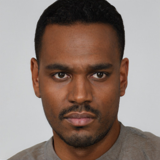 Neutral black young-adult male with short  black hair and brown eyes