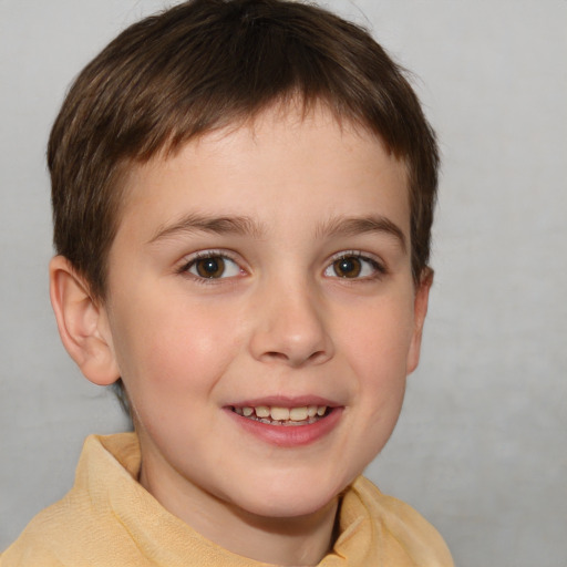 Joyful white child male with short  brown hair and brown eyes