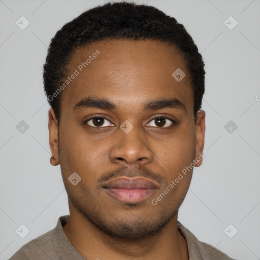 Neutral latino young-adult male with short  brown hair and brown eyes