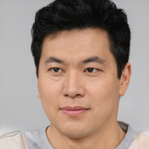 Neutral asian young-adult male with short  black hair and brown eyes