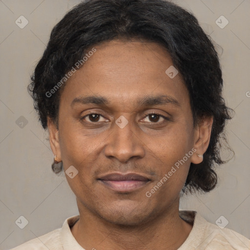 Joyful latino adult male with short  black hair and brown eyes