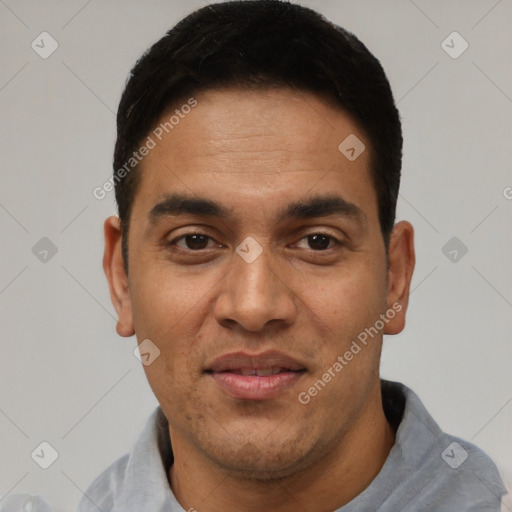 Joyful white adult male with short  black hair and brown eyes