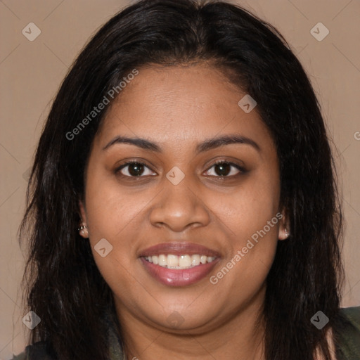 Joyful black young-adult female with long  brown hair and brown eyes