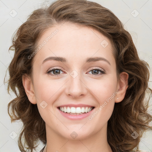 Joyful white young-adult female with medium  brown hair and green eyes