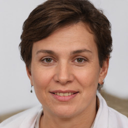 Joyful white adult female with short  brown hair and brown eyes