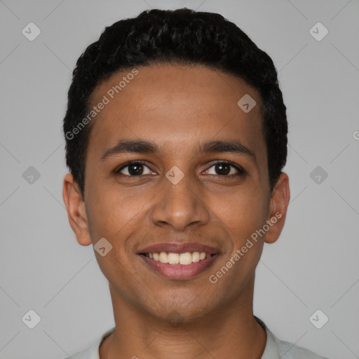 Joyful latino young-adult male with short  black hair and brown eyes