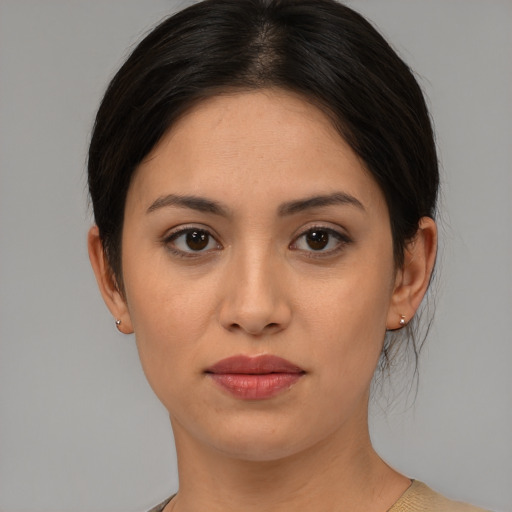 Joyful asian young-adult female with medium  brown hair and brown eyes