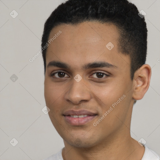 Joyful black young-adult male with short  black hair and brown eyes