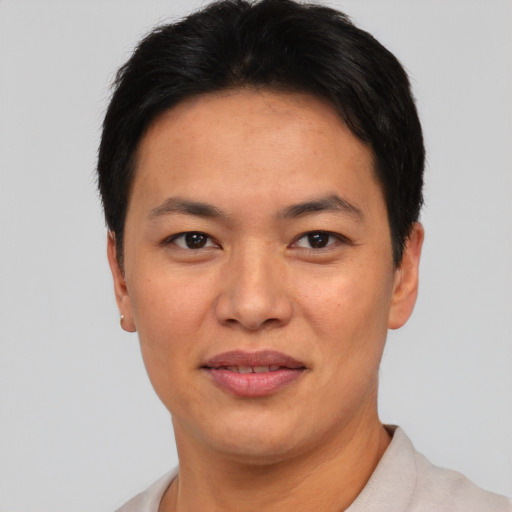Joyful asian young-adult female with short  black hair and brown eyes