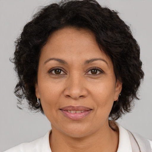 Joyful white adult female with short  brown hair and brown eyes