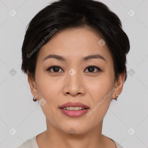 Joyful asian young-adult female with short  brown hair and brown eyes