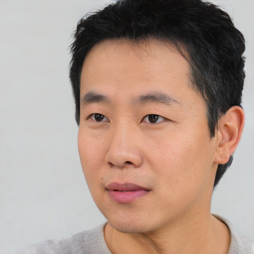 Neutral asian young-adult male with short  black hair and brown eyes