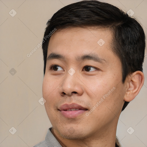 Joyful white young-adult male with short  black hair and brown eyes