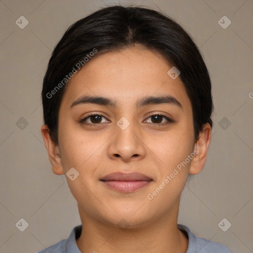 Joyful latino young-adult female with short  brown hair and brown eyes