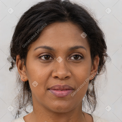 Joyful latino adult female with medium  brown hair and brown eyes