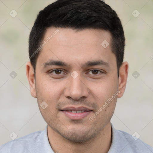 Joyful white young-adult male with short  black hair and brown eyes