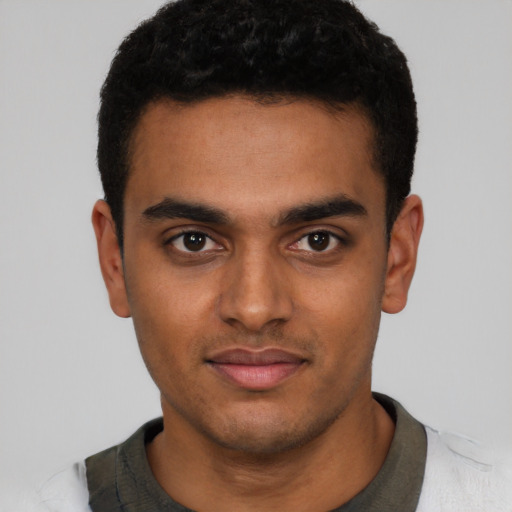 Neutral black young-adult male with short  black hair and brown eyes