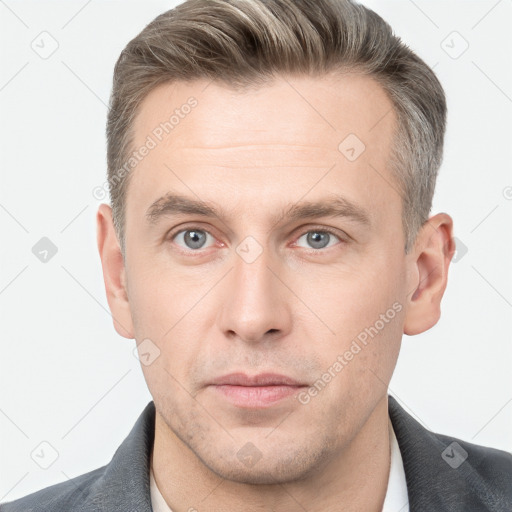 Neutral white adult male with short  brown hair and grey eyes