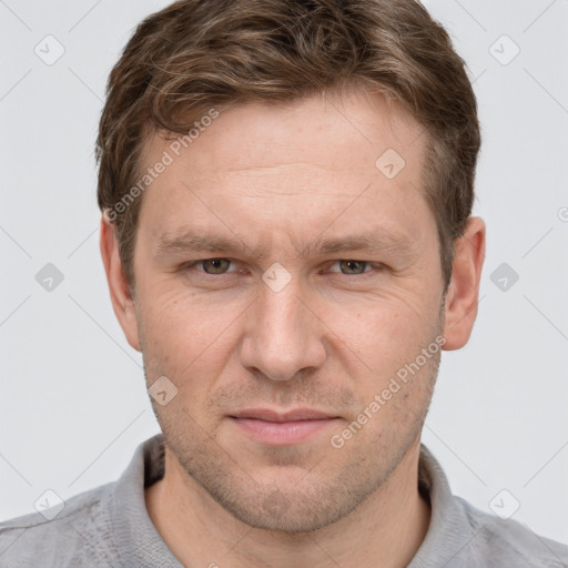 Joyful white adult male with short  brown hair and grey eyes