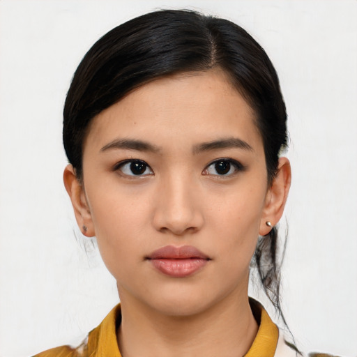 Neutral asian young-adult female with medium  black hair and brown eyes