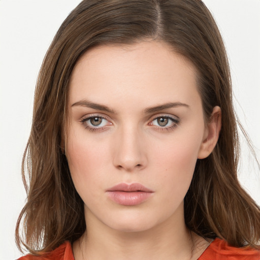 Neutral white young-adult female with long  brown hair and brown eyes