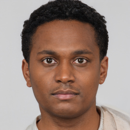 Neutral latino young-adult male with short  brown hair and brown eyes