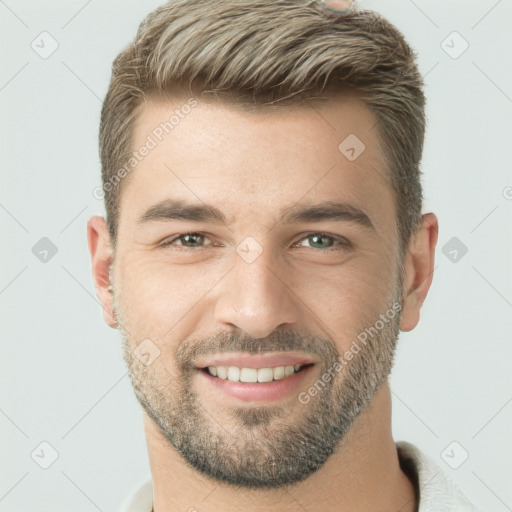 Joyful white young-adult male with short  brown hair and brown eyes