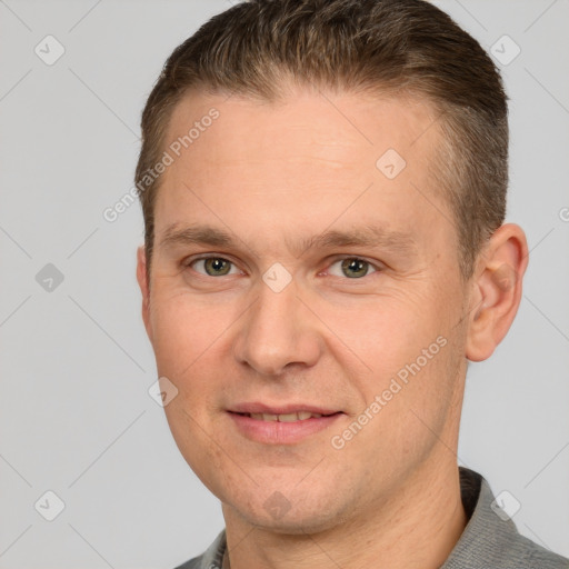 Joyful white adult male with short  brown hair and brown eyes