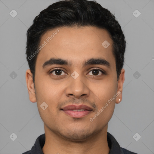 Joyful latino young-adult male with short  black hair and brown eyes