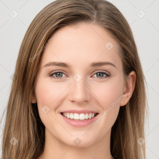 Joyful white young-adult female with long  brown hair and green eyes