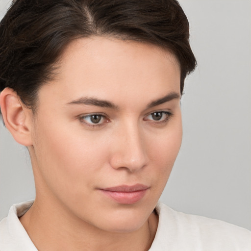 Neutral white young-adult female with short  brown hair and brown eyes