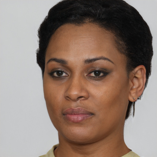 Neutral black young-adult female with short  brown hair and brown eyes