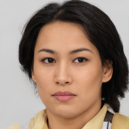 Neutral asian young-adult female with medium  brown hair and brown eyes