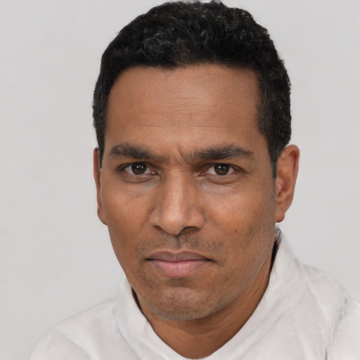 Neutral black adult male with short  black hair and brown eyes