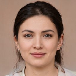 Joyful white young-adult female with medium  brown hair and brown eyes