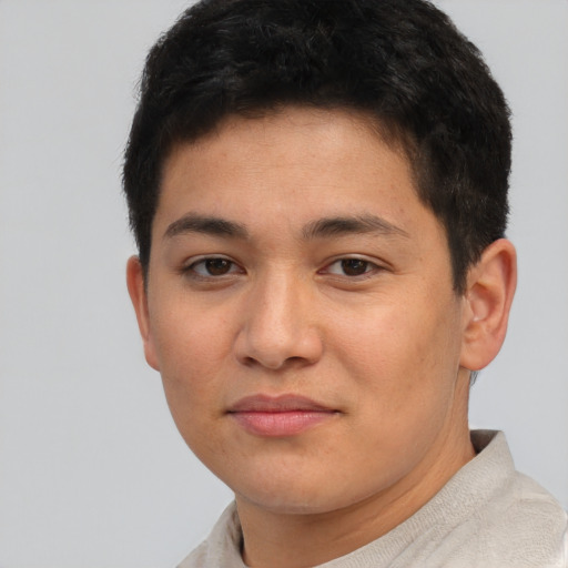 Joyful latino young-adult male with short  brown hair and brown eyes