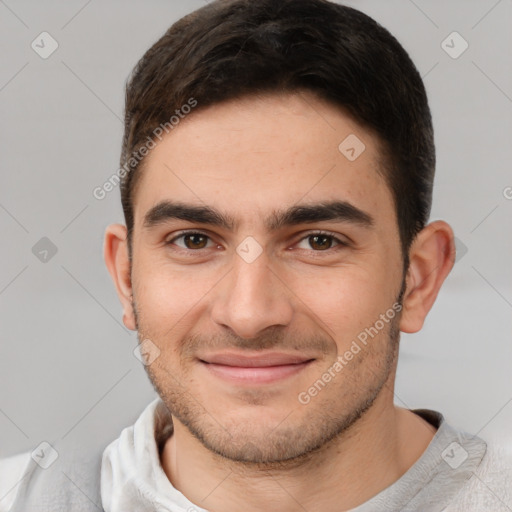 Joyful white young-adult male with short  brown hair and brown eyes